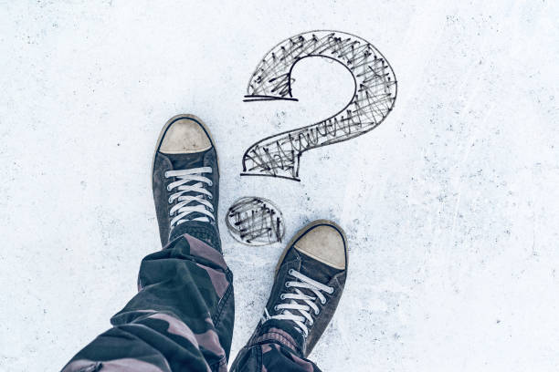 istock Question mark on the road and sneakers 869258502