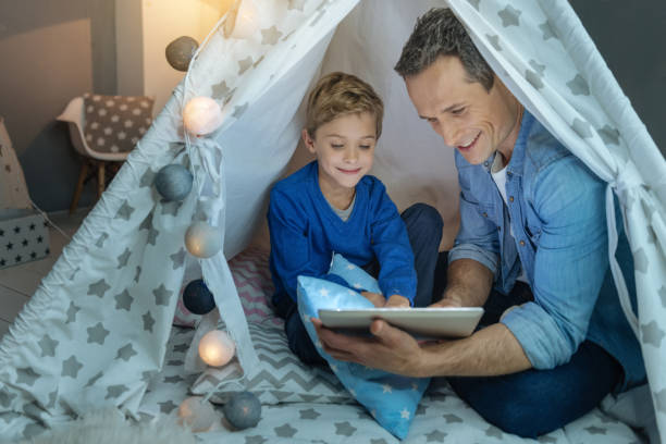 istock Happy man reading fairy tales 869258858