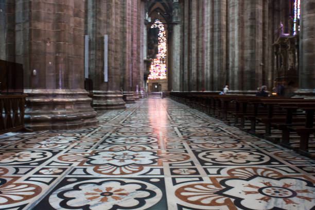 Inside Duomo cathedral in Milan, Milan: Inside Duomo cathedral in Milan, detail of the decorated floor in candoglia marble with flower pattern candoglia marble stock pictures, royalty-free photos & images