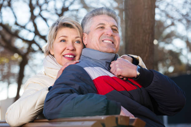 istock Mature couple on park bench 869259828