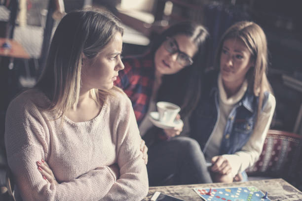 istock Girls playing board game at home and having serious conversation. Close up. 869262006