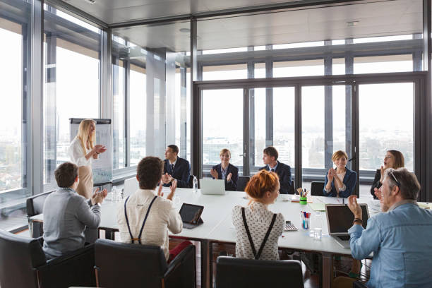 istock Business people clapping hands after successful meeting  in modern office. 869264128