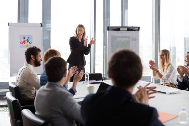 istock Business people clapping hands during the meeting in modern office. 869265558