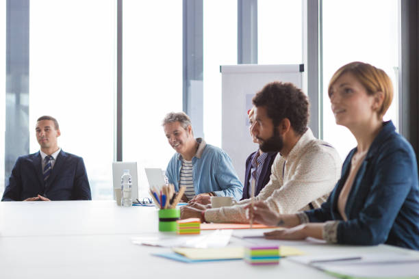 istock Business people having meeting in modern office. 869266338