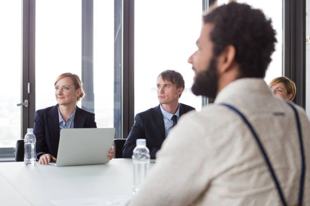 istock Business people having meeting in modern office. 869266742