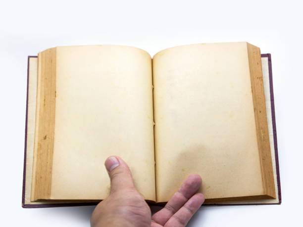 istock hand hold old paper vintage book texture 869267270