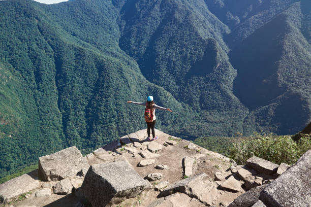 istock Happy woman look on mountains 869269508