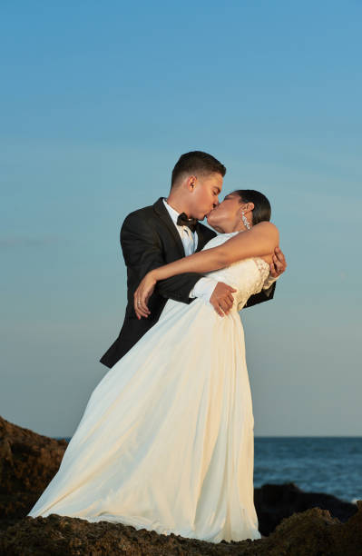 istock Groom kissing bride 869270602
