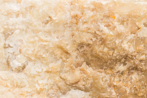 Lightened slices marble onyx. Horizontal image. Warm colors. Beautiful close up background. Orange onyx marble texture. Ideal for sites, banners, brochures, design