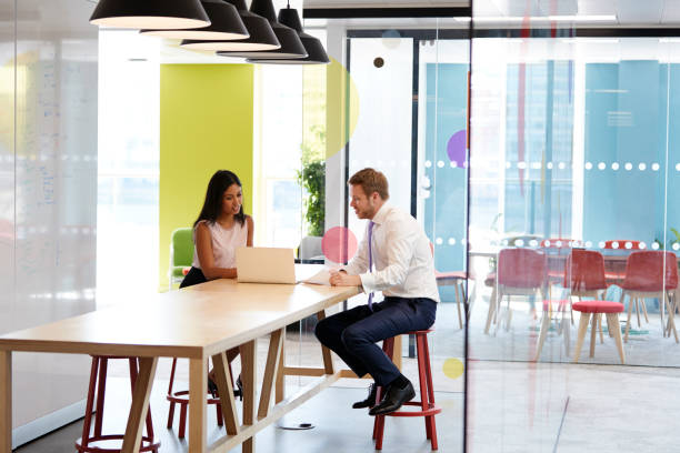 istock Man and woman having an informal meeting at work 869282568