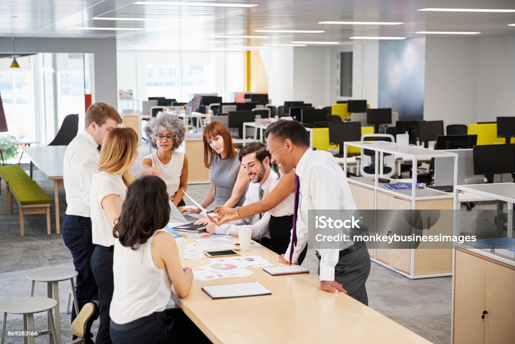 Business team brainstorm in open plan office, elevated view Office Stock Photo