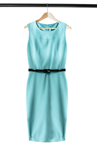 Elegant sleeveless blue dress on wooden clothes rack isolated over white