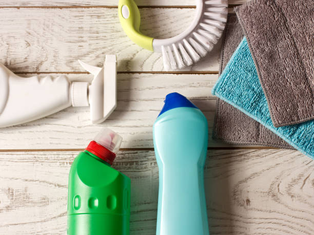 istock Colored microfiber napkins, cleaning agent, spray and brush on the white floor. 869286254