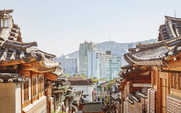 Bukchon Hanok Village Houses and Roofs. View to downtown Seoul Skyline and N Seoul Tower. Historic Bukchon Hanok Neighborhood of Seoul South Korea, Asia.