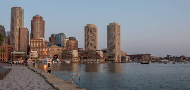 istock Sunrise sunshine reflecting on Boston Downtown Skyline 869286950