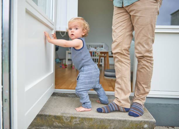 istock Man and child coming out from the dining room 869287340
