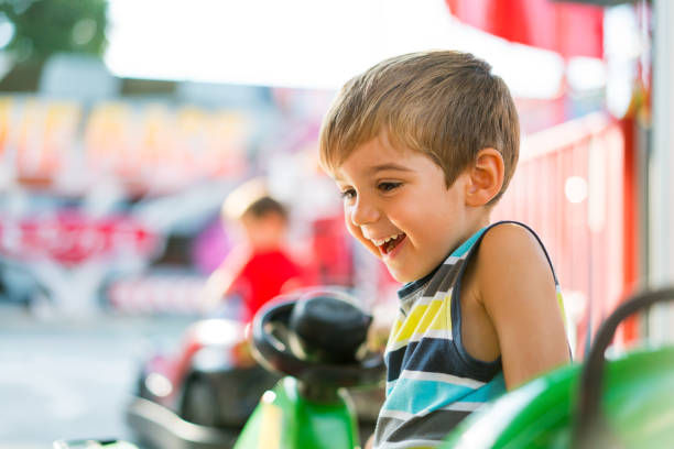 istock real people little boy in amusement park 869287460