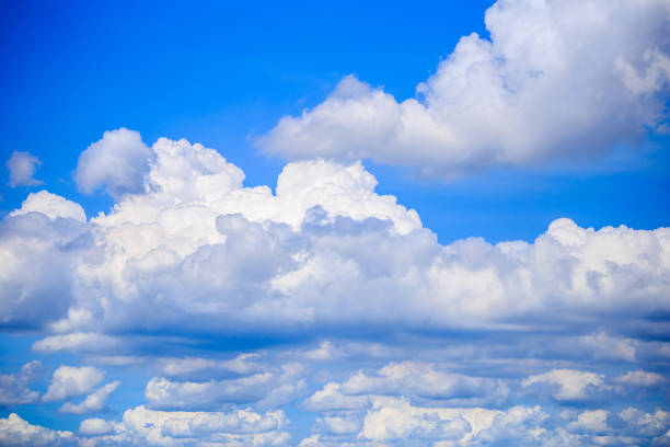 istock Photo of some white whispy clouds and blue sky cloudscape 869290278