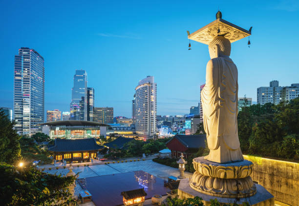 Bongeunsa Temple Seoul at Night South Korea Famous Bongeunsa Temple Buddha Statue at Night, Twilight. Modern Skyscrapers of downtown Seoul illuminated in the background. Seoul, South Korea, Asia. aerial view of seoul south korea capital city stock pictures, royalty-free photos & images