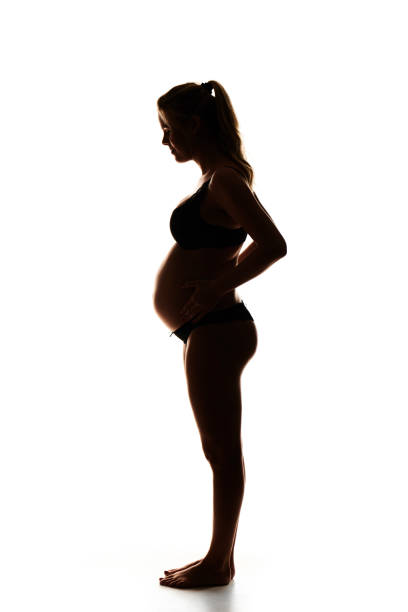 istock Blond pregnant young woman in profile 869291416