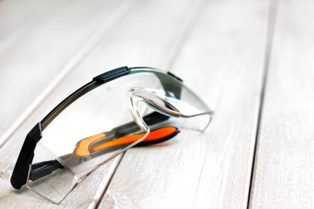 istock safety glasses on wooden plank 869291950