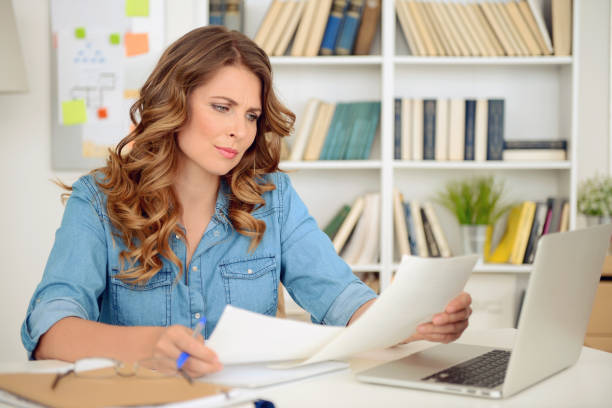 istock blonde woman working in the office 869294176