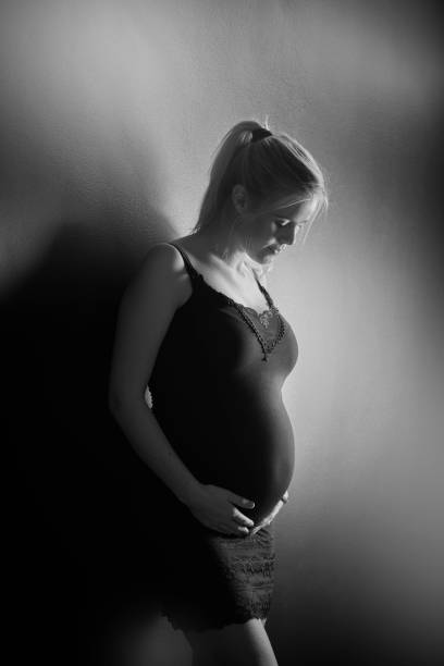istock Blond pregnant young woman in profile 869294974