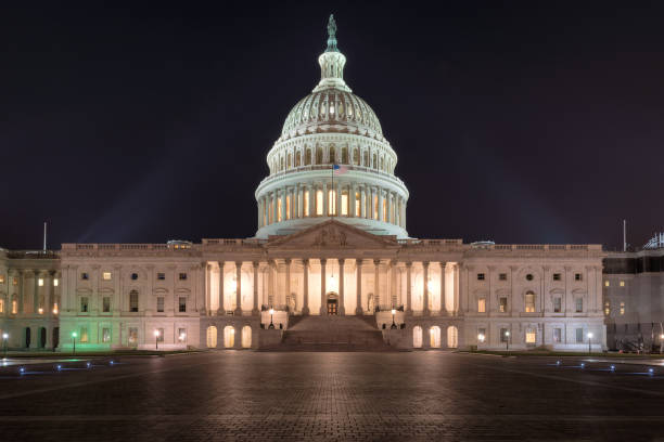 istock The United States Capitol building at night 869295638