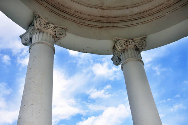 istock arbor with columns in the background of a cloudy sky 869298354