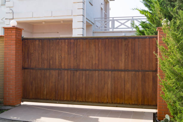 Brown Automatic Wooden Gates Of Private House Stock Photo - Download Image  Now - Gate, Wood - Material, Door - Istock