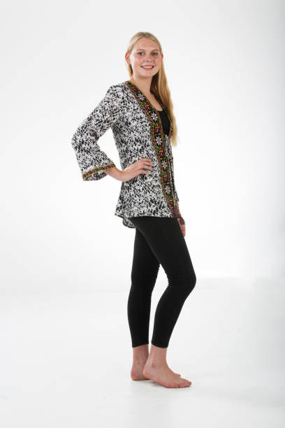 istock Blond model wearing a disigner top with white background 869301174