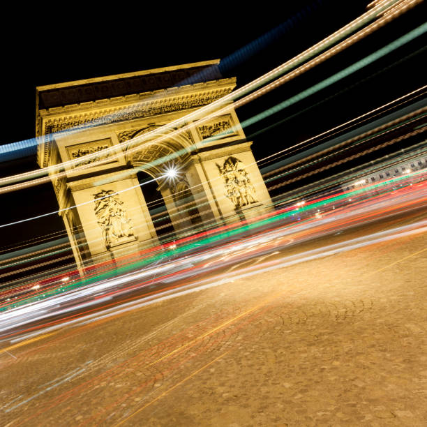 istock Arc de Triomphe with light streaks at night, Paris, France 869301714