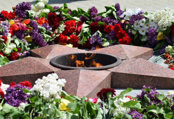 istock Eternal flame with flowers assigned to it 869302472