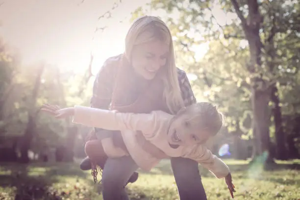 Family time in autumn park.