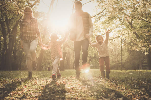 istock Family in autumn park. 869313156