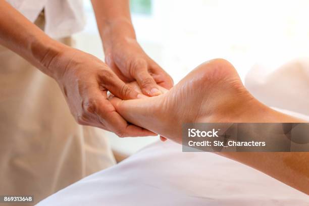 Young Woman Having Foot Massage In Spa Salon Close Up Stock Photo - Download Image Now