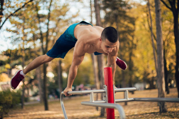 istock Muscular man training strength outdoors 869314142
