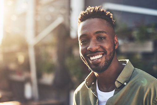 Cropped shot of a handsome young man chilling at an outdoors coffee shop