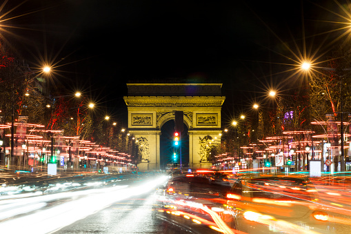 Champs-Elysees at night with traffic, Paris, France