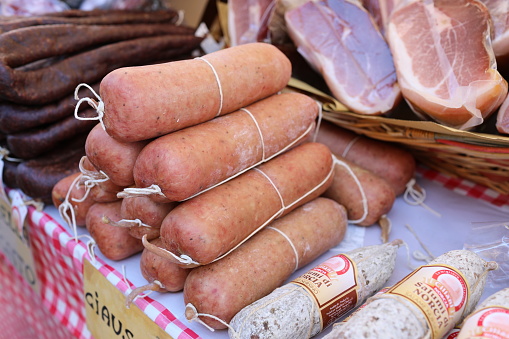 Manziana, Lazio: Famous Norcia salami and prosciutto, typical of Umbria and Marche, as ciauscolo and  liver salami for sale on street stall at the chestnut festival.