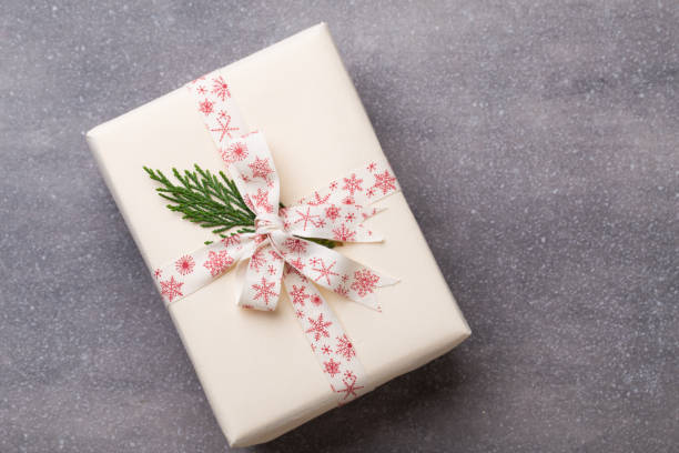 istock Christmas presents with ribbon on grey  background. 869329524