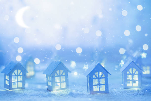 istock Small wooden houses and garlands. 869329596