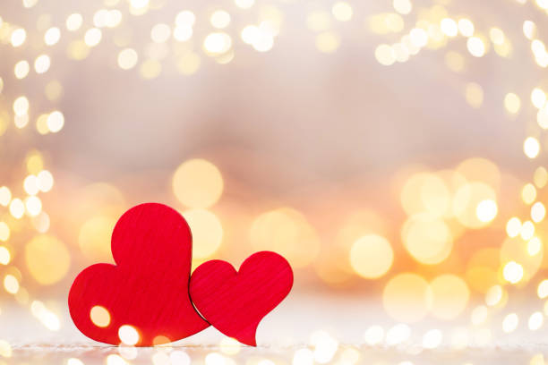 istock Red hearts on the wooden background. 869330046