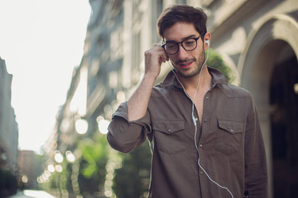 istock Handsome man listening to some music 869331202