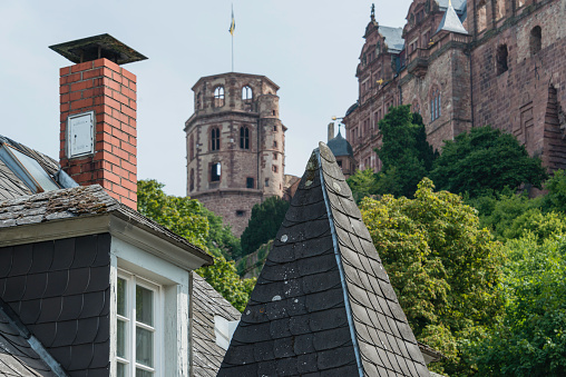 Low angle view from public street of a turret of the Heidelberg Castle ruin in the old town section of the historic city of Heidelberg, Germany.