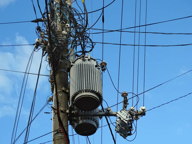 istock Powerline insulators, connectors, transformers and tangled wires on electrical pole 869331530