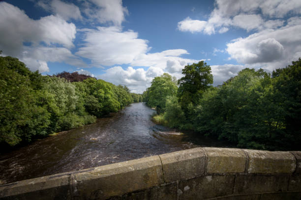 River Wharfe viewed from bridge at Ilkley England View on the river Wharfe England river wharfe stock pictures, royalty-free photos & images