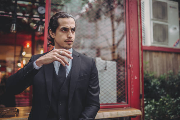 istock Businessman drinking coffee outdoors 869338126