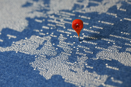 airplane fly on the blue painted felt map, serbia