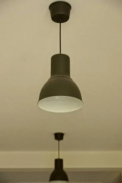 room with a gray modern chandelier on the ceiling